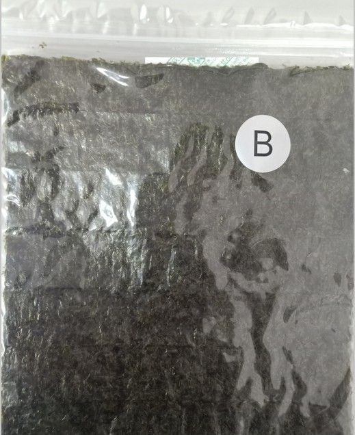 Classifichi un'alga arrostita asciutta dei sushi di Nori dei fiocchi organici dell'alga per l'alimento dell'involucro